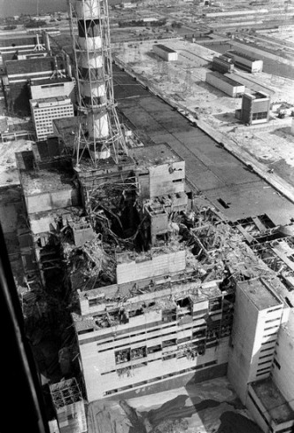 (FILES)- Picture taken from a helicopter in April 1986 shows a general view of the destroyed 4th power block of Chernobyl's nuclear power plant few days after the catastrophe. A reactor at Chernobyl blew up on April 26, 1986 in the worst nuclear accident in history. It burned for some 10 days, sending radiation across a large swathe of Ukraine, Russia and Belarus. A World Health Organisation report released in September put the overall death toll from Chernobyl at 4,000, though the figure is disputed as being too low. According to the Ukraine, 2.4 million of its people, among them 428,000 children, suffer health problems linked to the nuclear disaster. AFP PHOTO/VLADIMIR REPIK